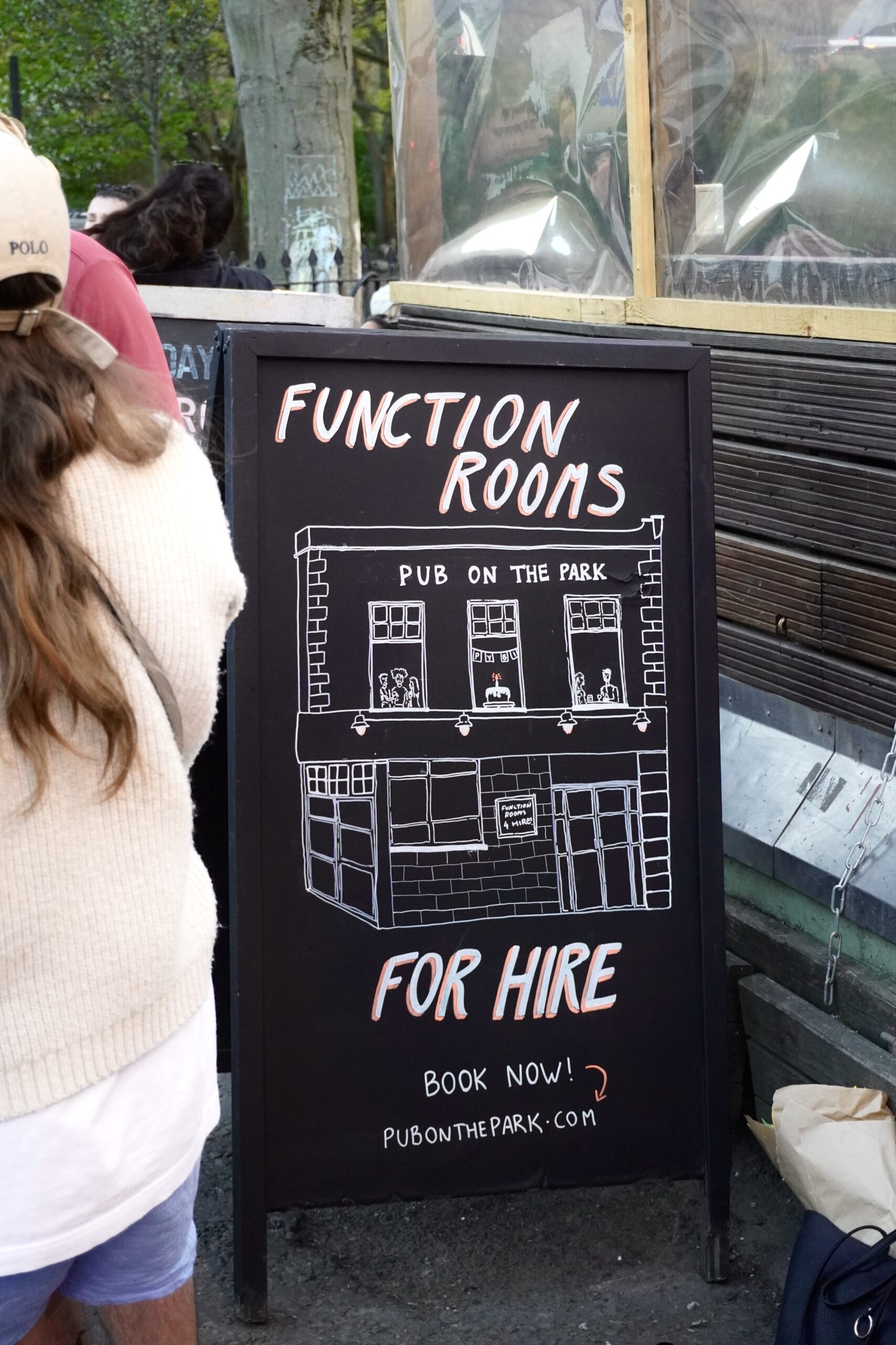 Photo of a large blackboard with an illustration of the pub on it and the words Function Rooms For Hire written on there.